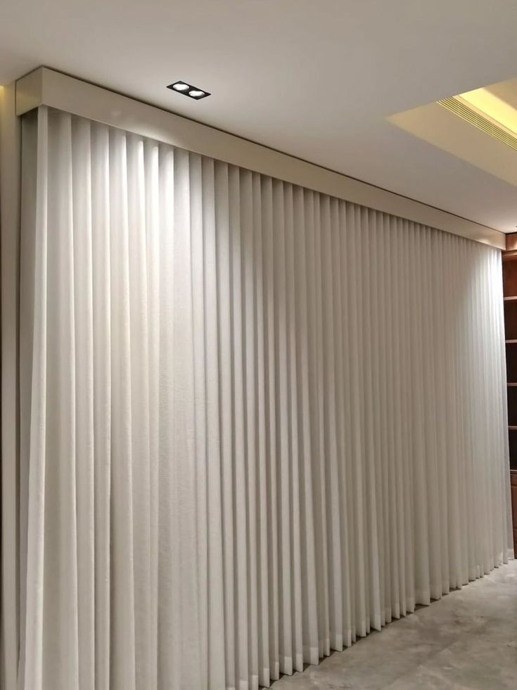 Pinch-pleat linen curtains in a Palm Jumeirah bedroom