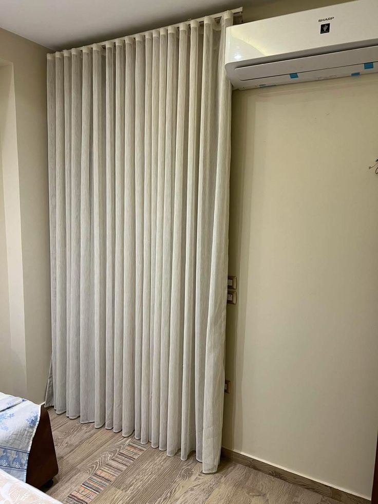 Roman blinds in a Mudon villa kitchen window